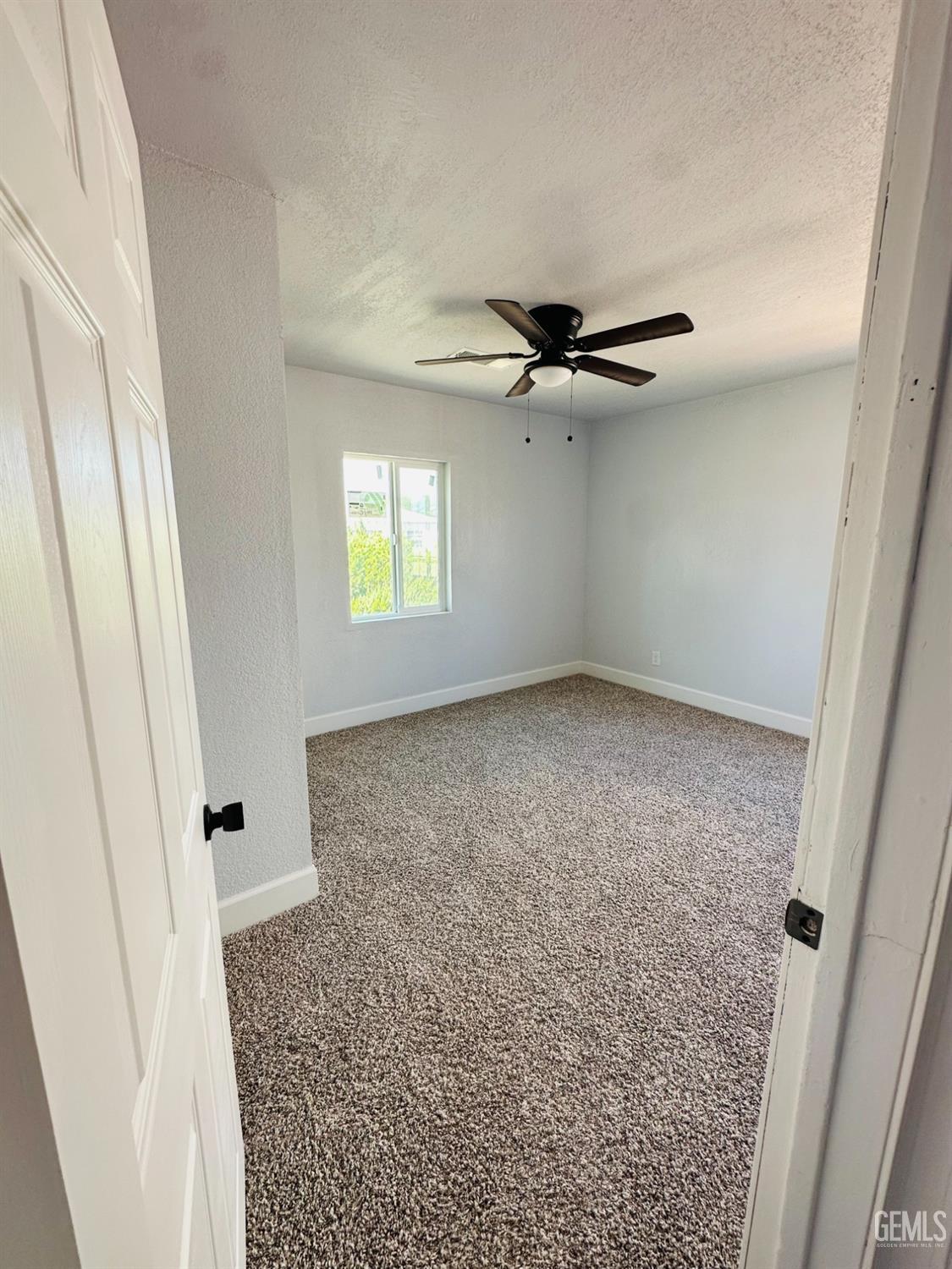 Undisclosed Address Delano, CA 93215 - Photo 6 of 20 wooden floor in an empty room with a window