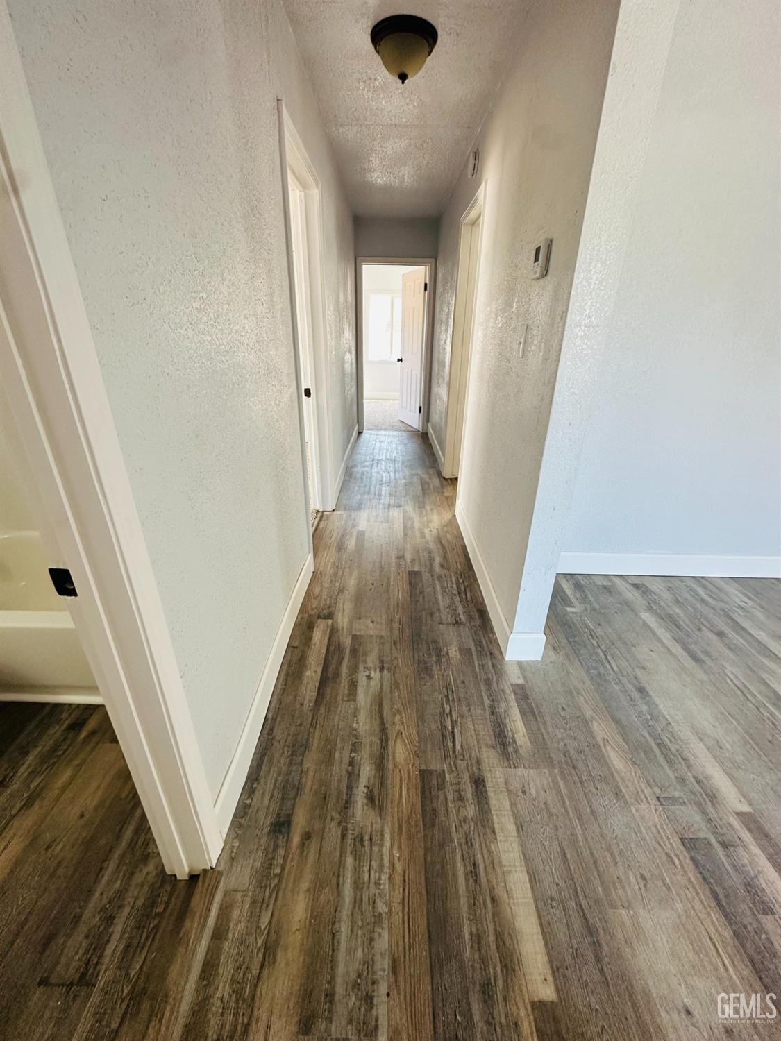 Undisclosed Address Delano, CA 93215 - Photo 10 of 20 wooden floor in a white room