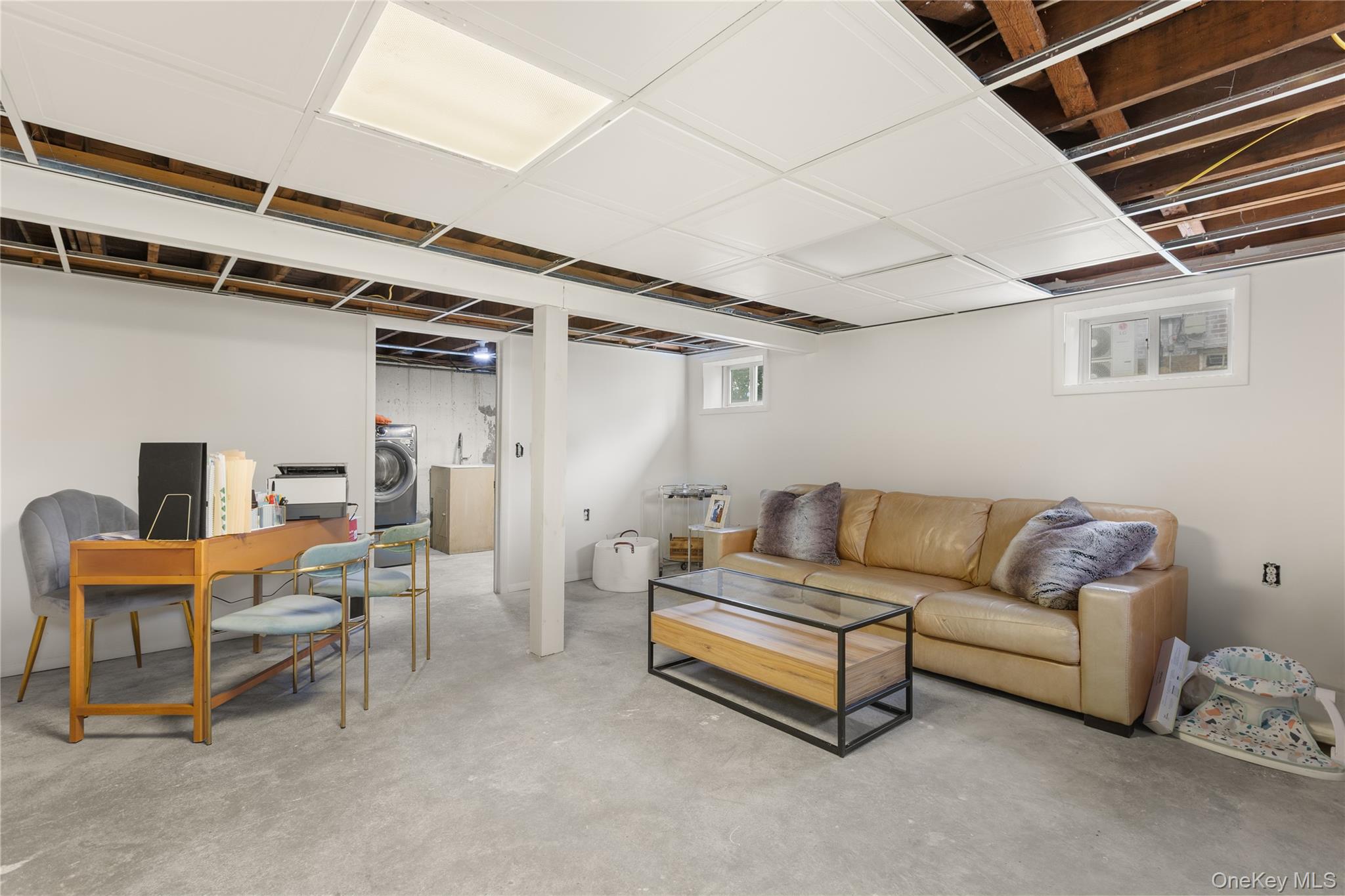 205 Timber Point Road East Islip, NY 11730 - Photo 11 of 16 Living area featuring washer / dryer and concrete floors