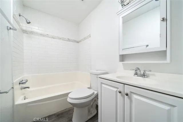 a bathroom with a sink a toilet and a bathtub