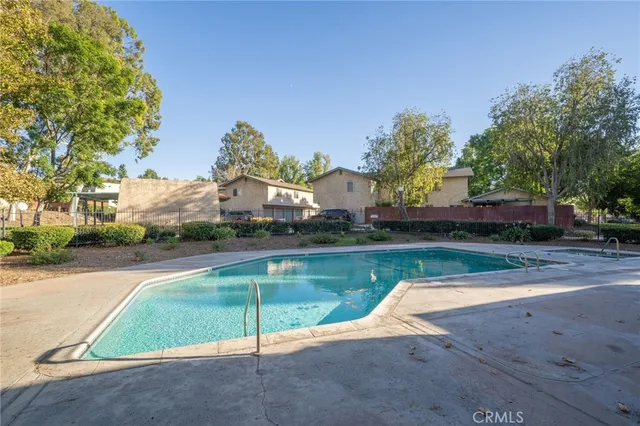 a view of a swimming pool with a patio