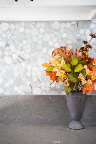 a view of a vase of flowers sitting on a table