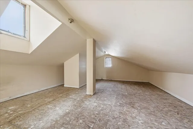 a view of an empty room with stairs