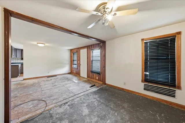 a view of an empty room with a window