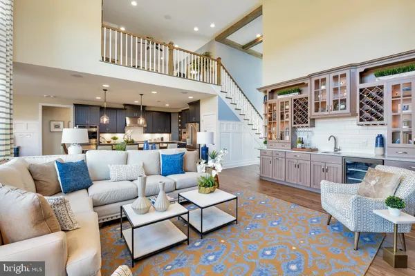 a living room with furniture and a book shelf