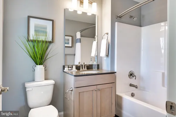 a bathroom with a toilet a sink and a bathtub