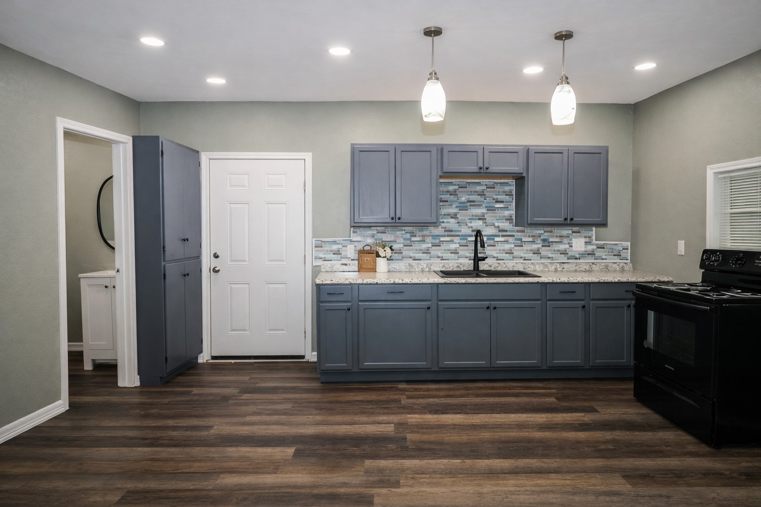 2727 Nelga Road, Unit B Wharton, TX 77488 - Photo 2 of 7 a kitchen with a sink stove and refrigerator