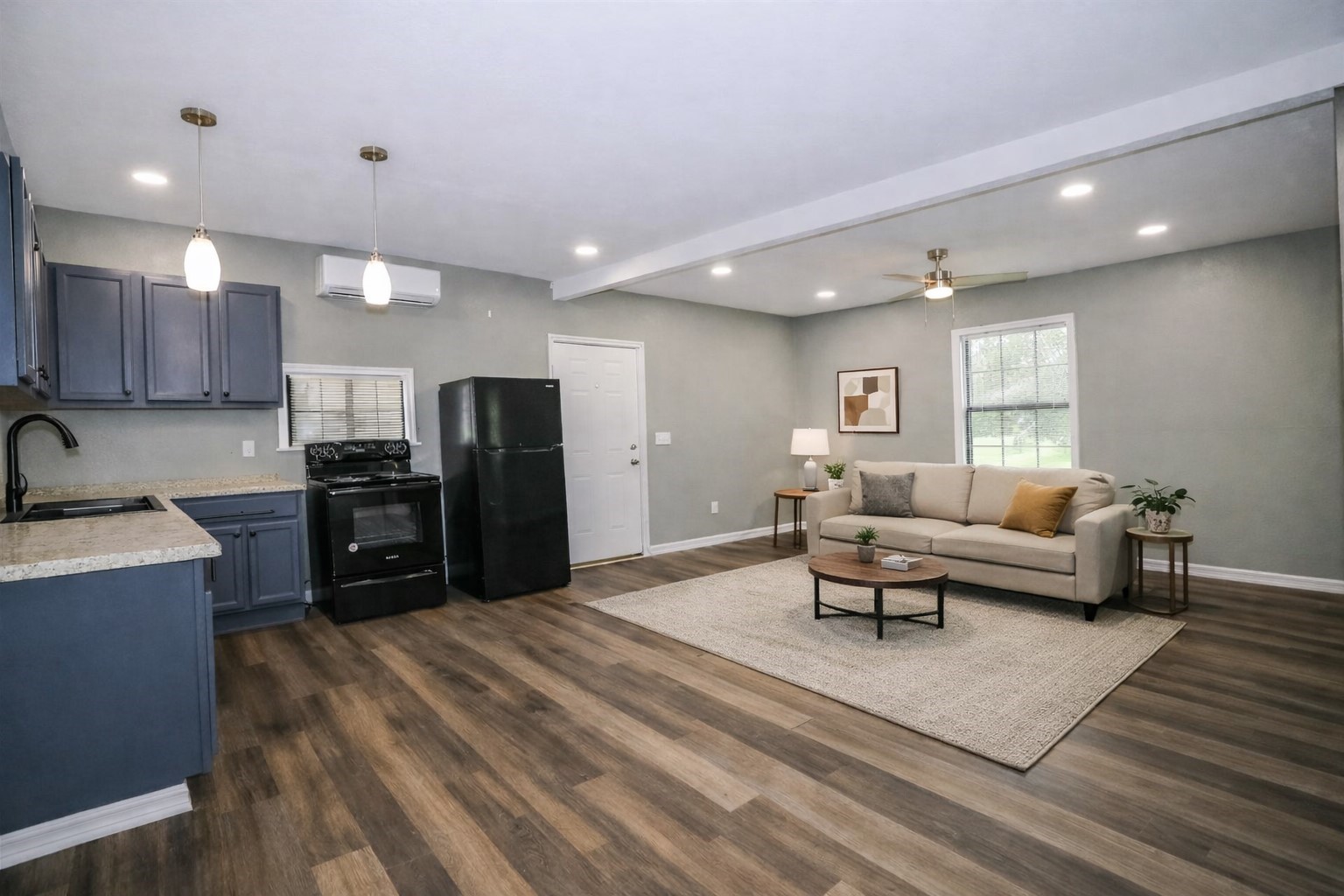 2727 Nelga Road, Unit B Wharton, TX 77488 - Photo 3 of 7 a living room with furniture and a wooden floor