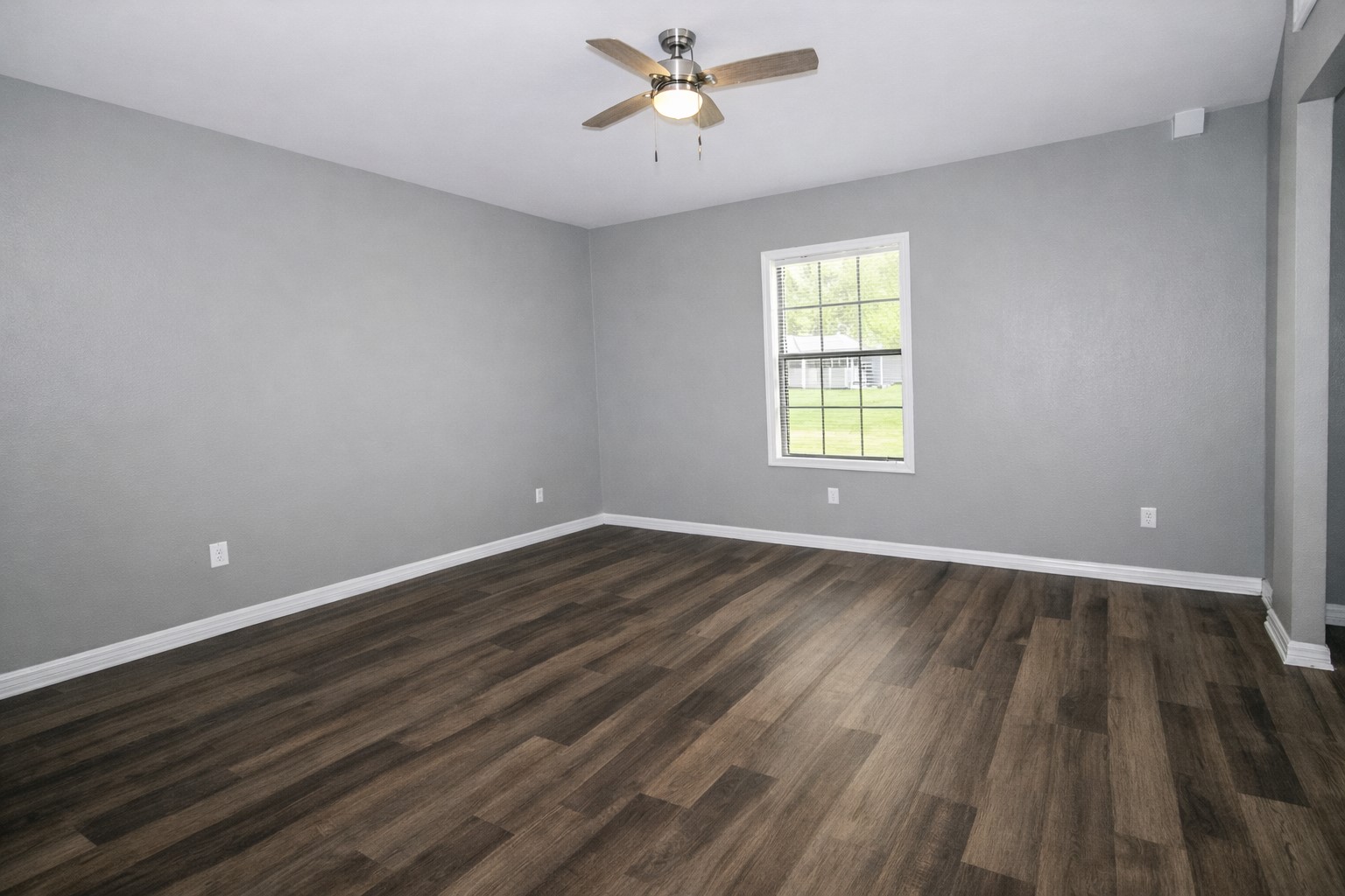 2727 Nelga Road, Unit B Wharton, TX 77488 - Photo 6 of 7 wooden floor in an empty room with a window