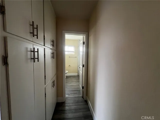 a view of a kitchen from the hallway