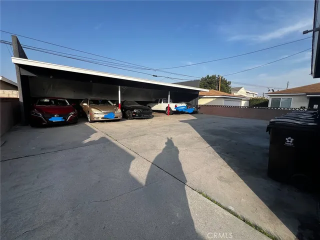 a view of parking garage with cars parked