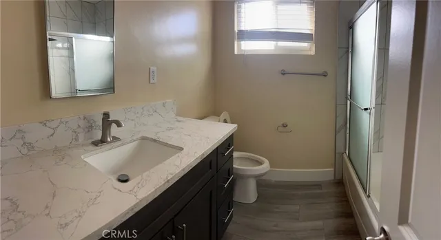 a bathroom with a sink and a toilet