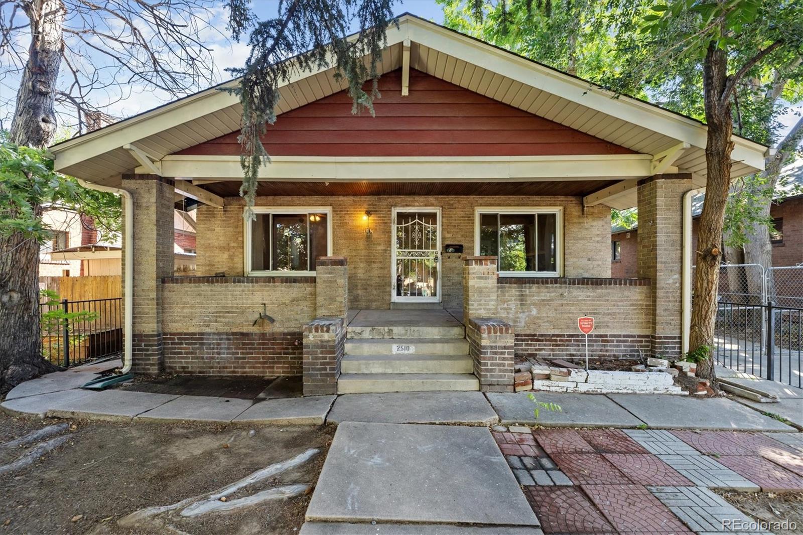 2510 Cherry Street Denver, CO 80207 - Photo 1 of 45 a front view of a house