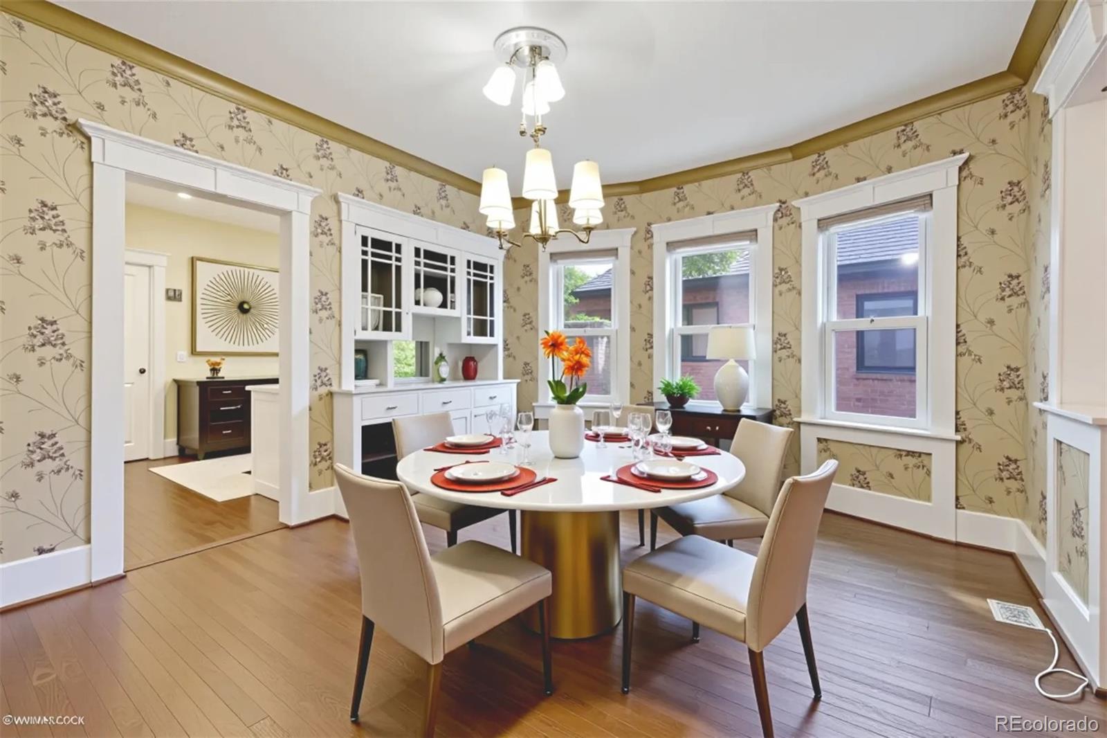 2510 Cherry Street Denver, CO 80207 - Photo 14 of 45 a view of a dining room with furniture wooden floor and chandelier