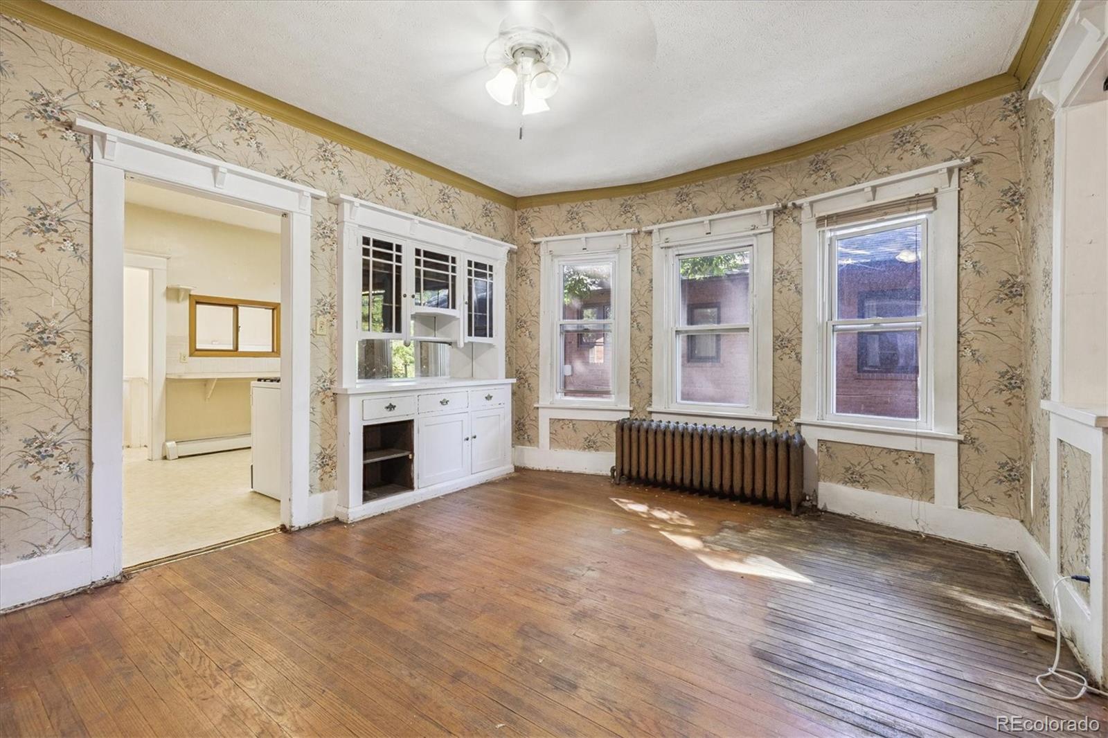 2510 Cherry Street Denver, CO 80207 - Photo 23 of 45 wooden floor and windows in an empty room