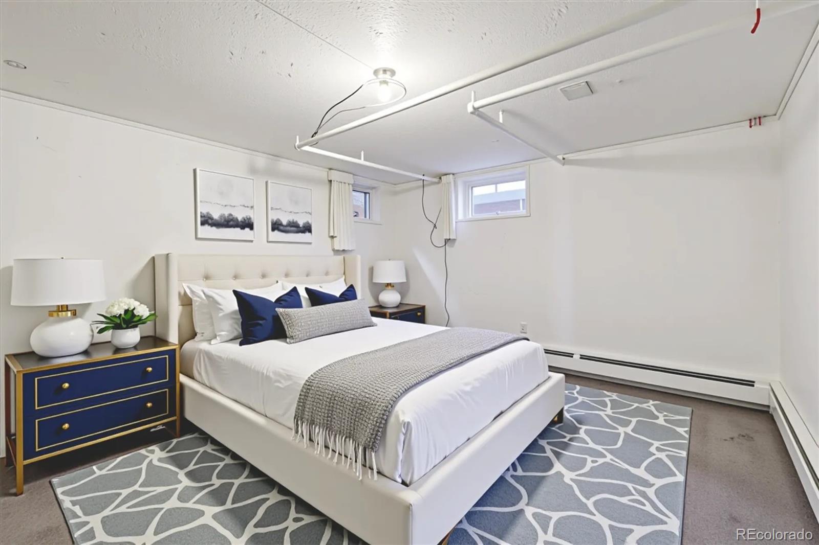 2510 Cherry Street Denver, CO 80207 - Photo 30 of 45 a bedroom with a bed and ceiling fan