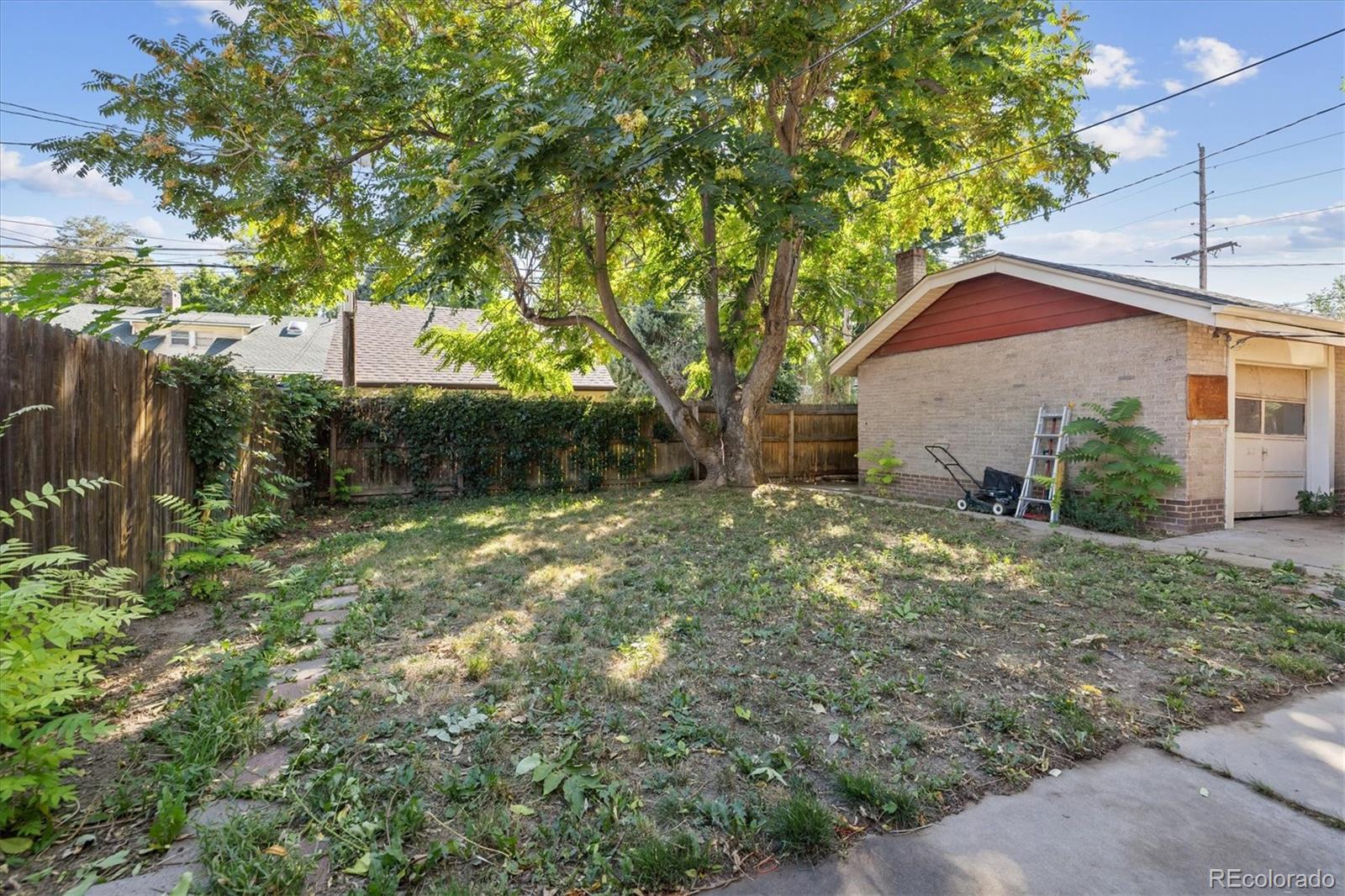 2510 Cherry Street Denver, CO 80207 - Photo 37 of 45 a backyard of a house with lots of green space