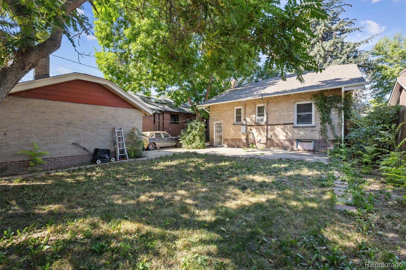 2510 Cherry Street Denver, CO 80207 - Photo 4 of 45 a house view with a garden space
