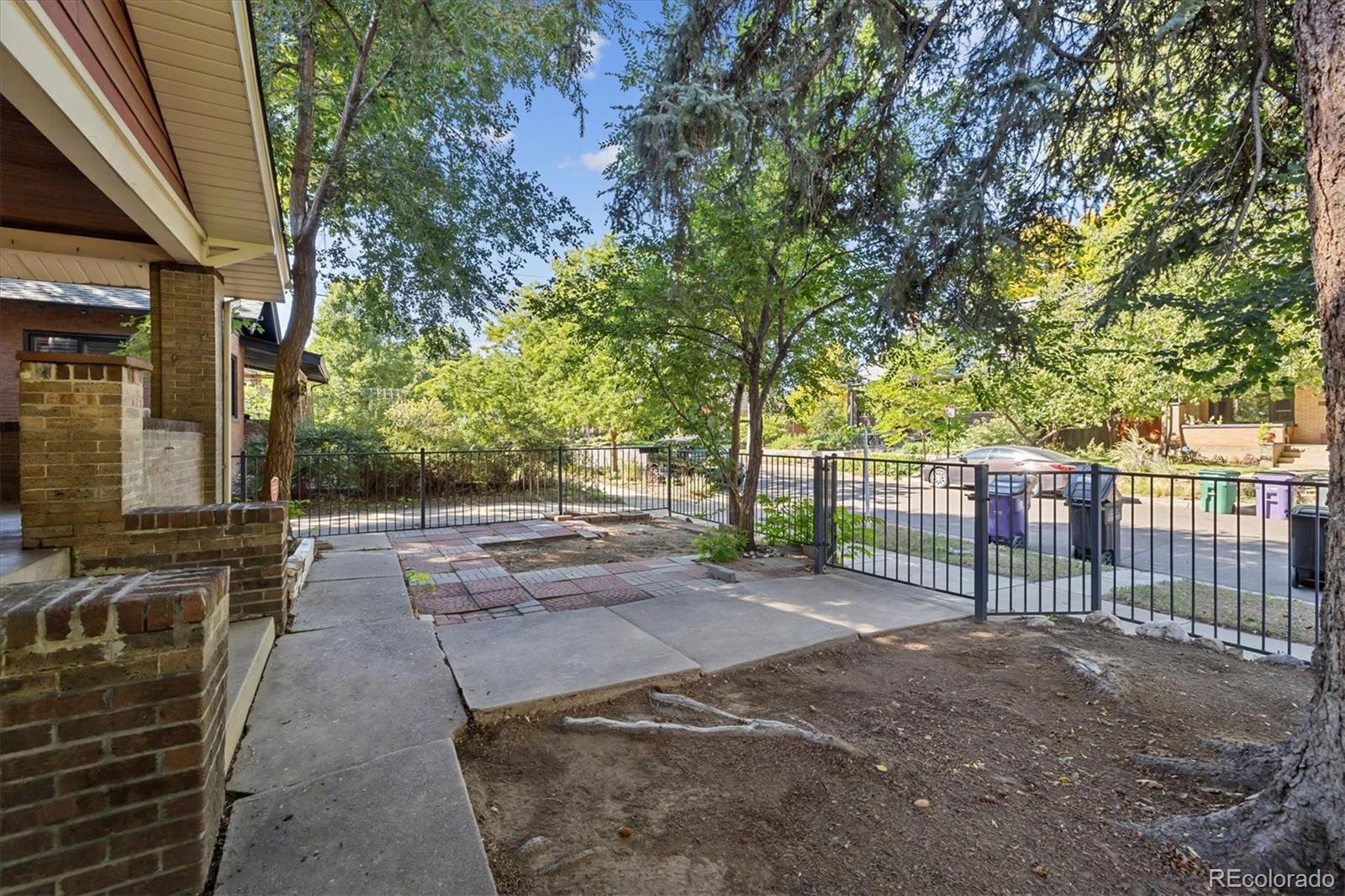 2510 Cherry Street Denver, CO 80207 - Photo 7 of 45 a view of a backyard with wooden fence