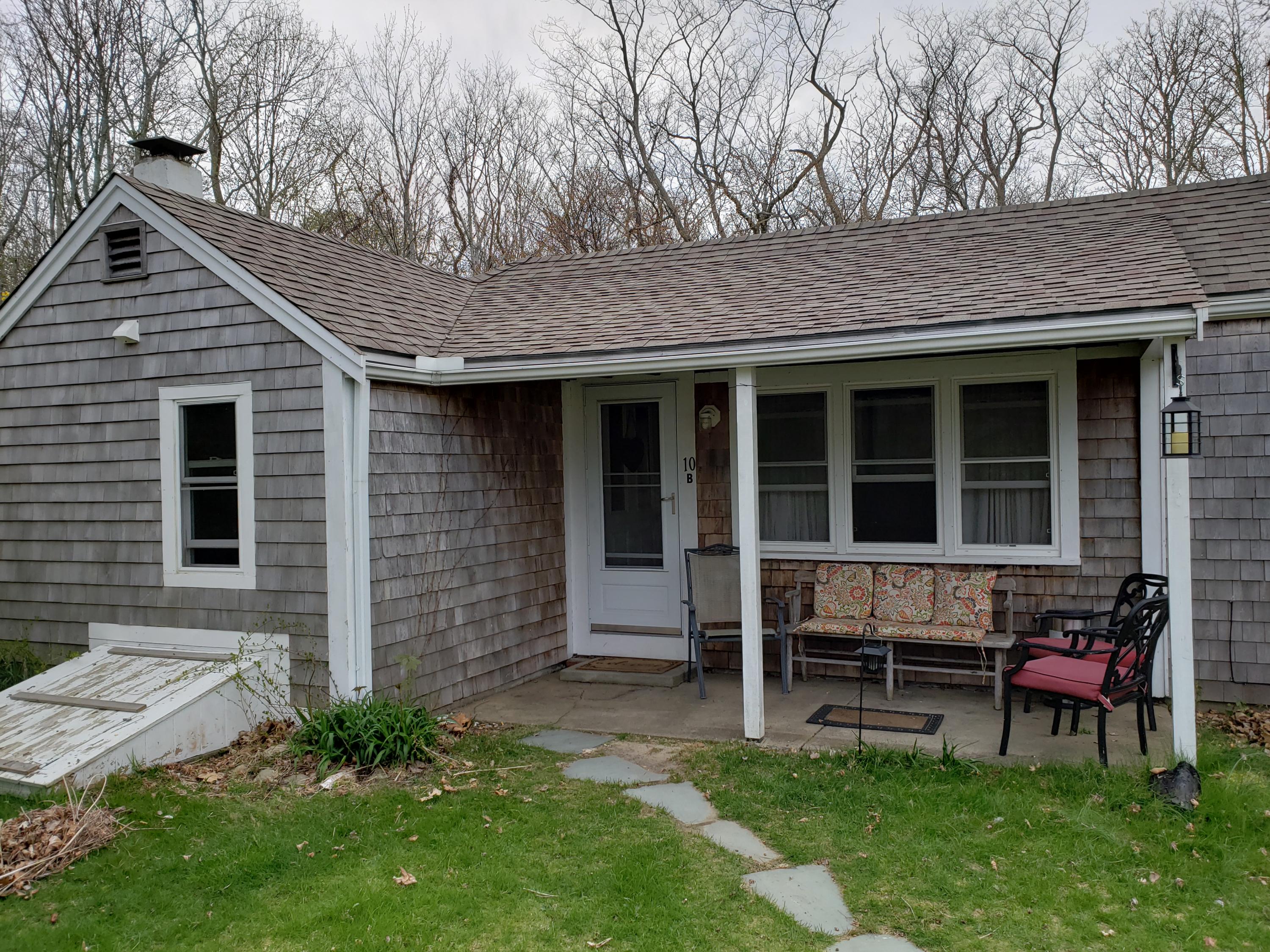 10 Childs Homestead Road Orleans, MA 02653 - Photo 4 of 23 a backyard of a house with table and chairs