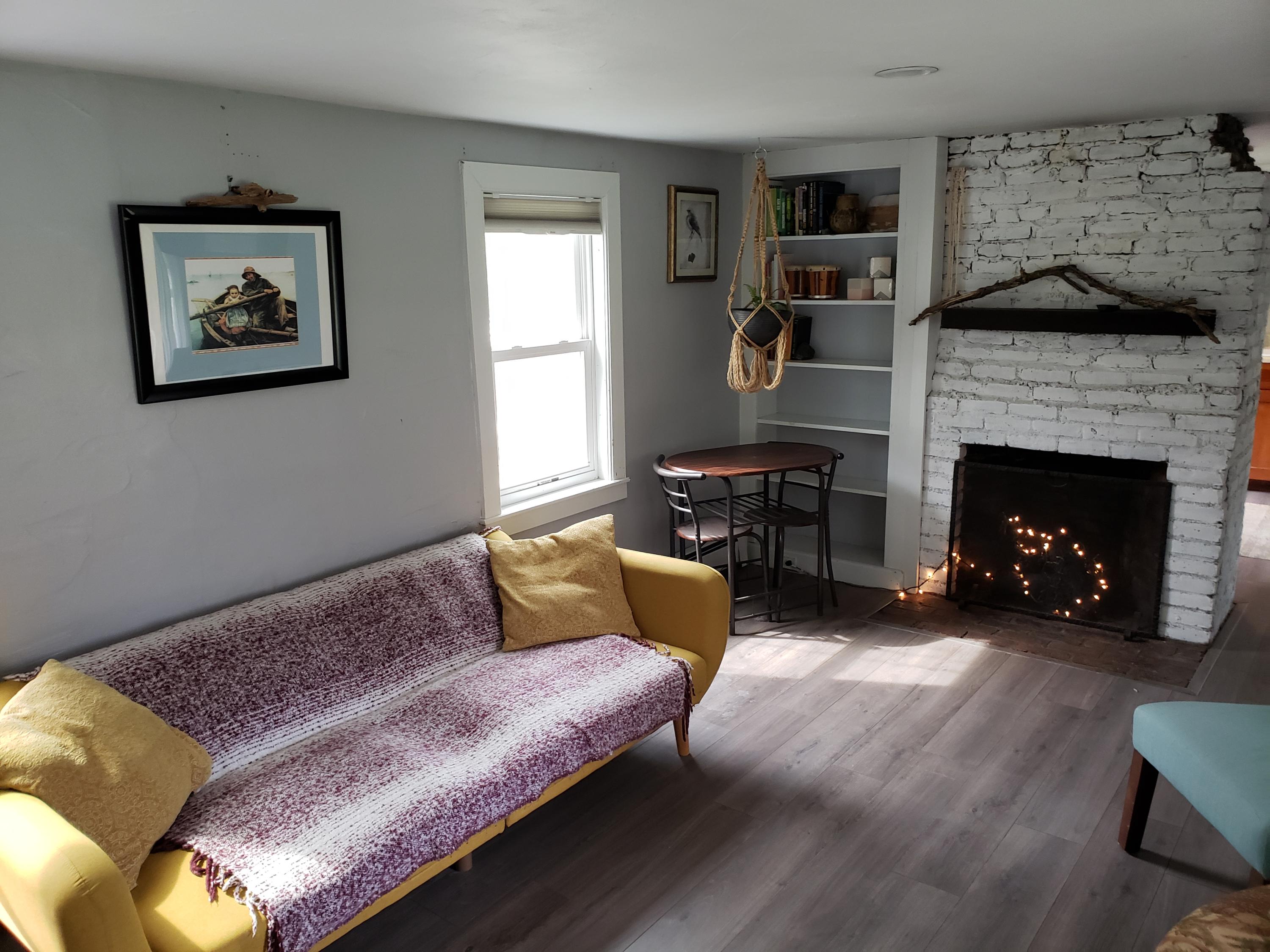 10 Childs Homestead Road Orleans, MA 02653 - Photo 6 of 23 a living room with furniture and a fireplace