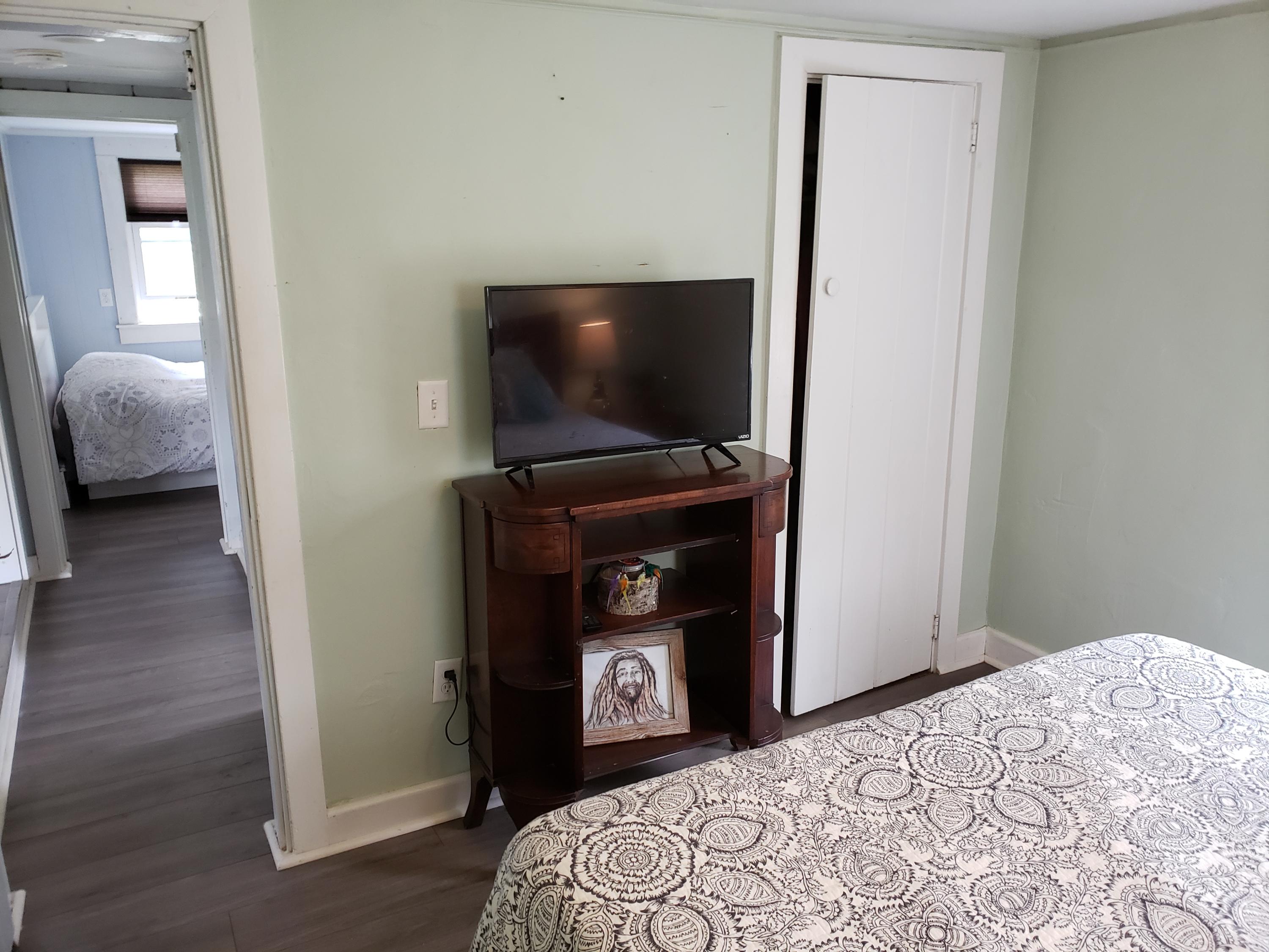 10 Childs Homestead Road Orleans, MA 02653 - Photo 10 of 23 a bedroom with a bed and a flat screen tv