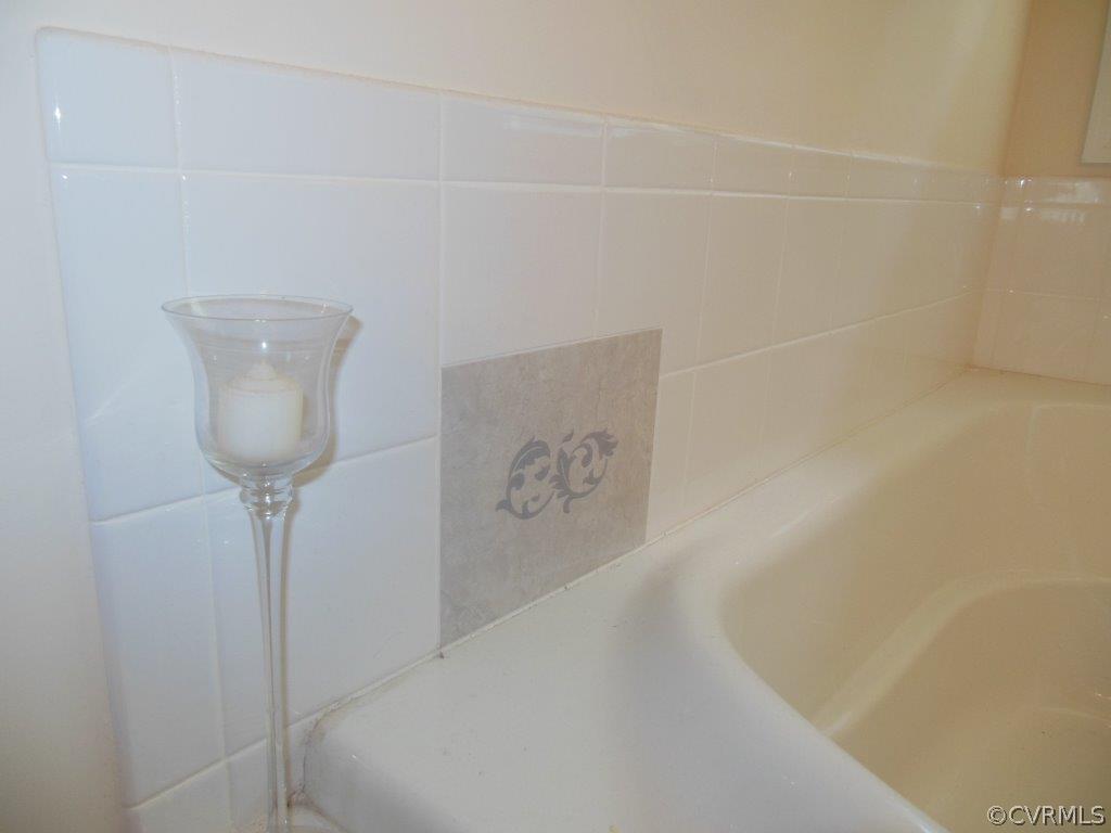 3050 Kinvan Road Henrico, VA 23231 - Photo 17 of 22 Custom Tiles in Master Bathroom Tub Surround