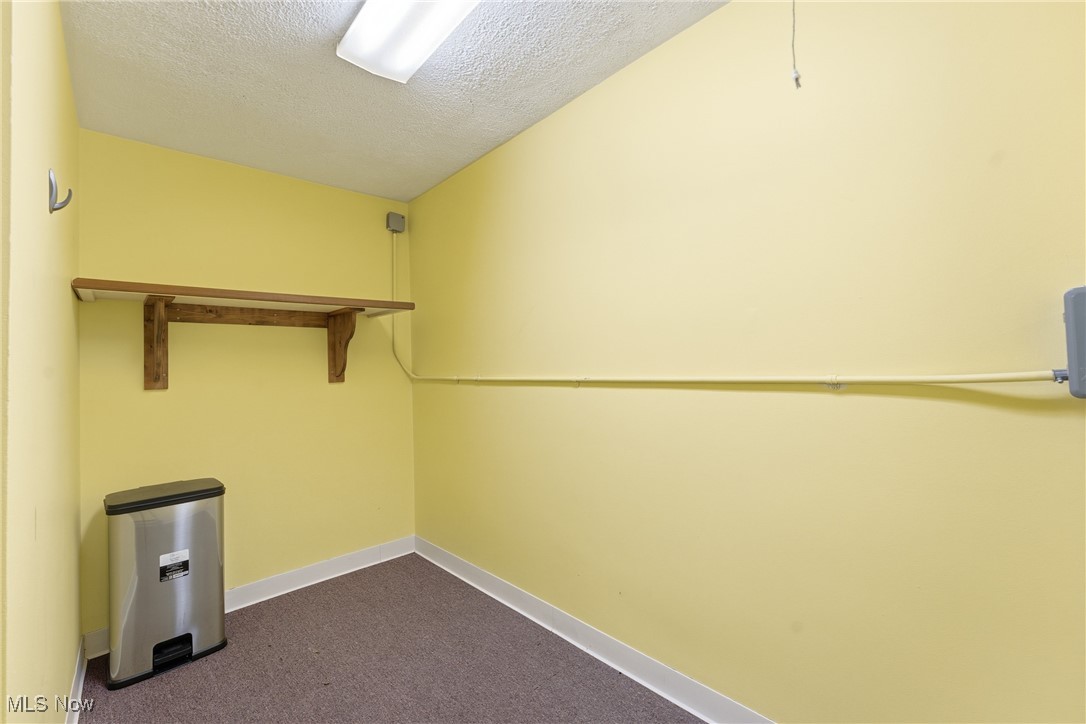 1817 Fulton Road Northwest Canton, OH 44709 - Photo 22 of 25 Spacious closet with dark carpet