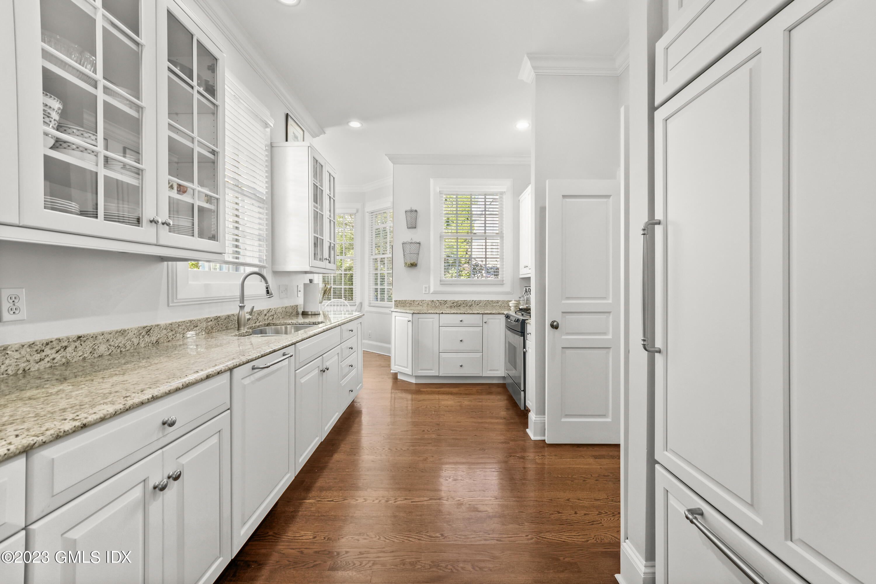 48 Spring Street, Unit 14 Greenwich, CT 06830 - Photo 11 of 29 a bathroom with a granite countertop sink mirror and a bathtub