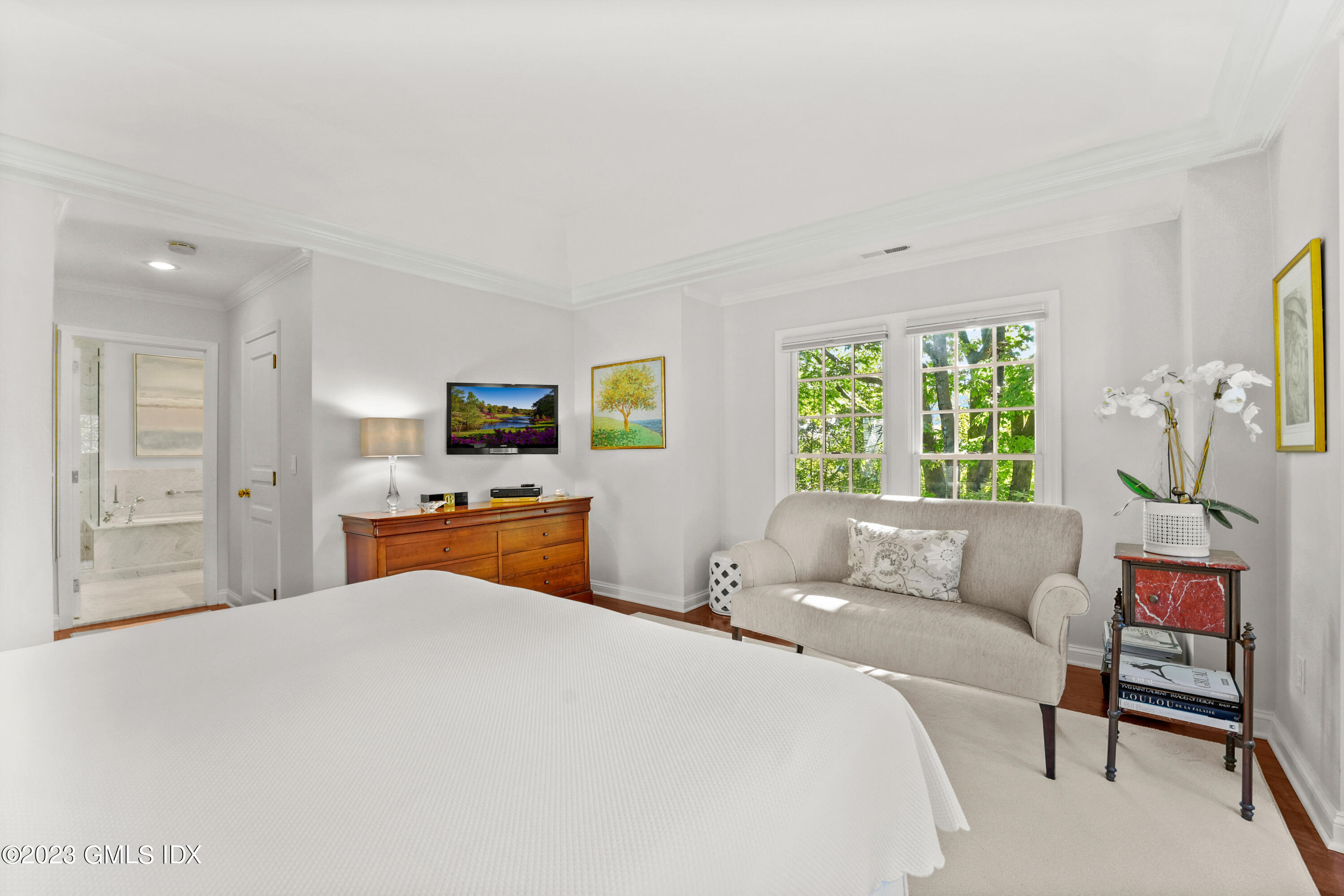 48 Spring Street, Unit 14 Greenwich, CT 06830 - Photo 15 of 29 a bedroom with a bed and a couch