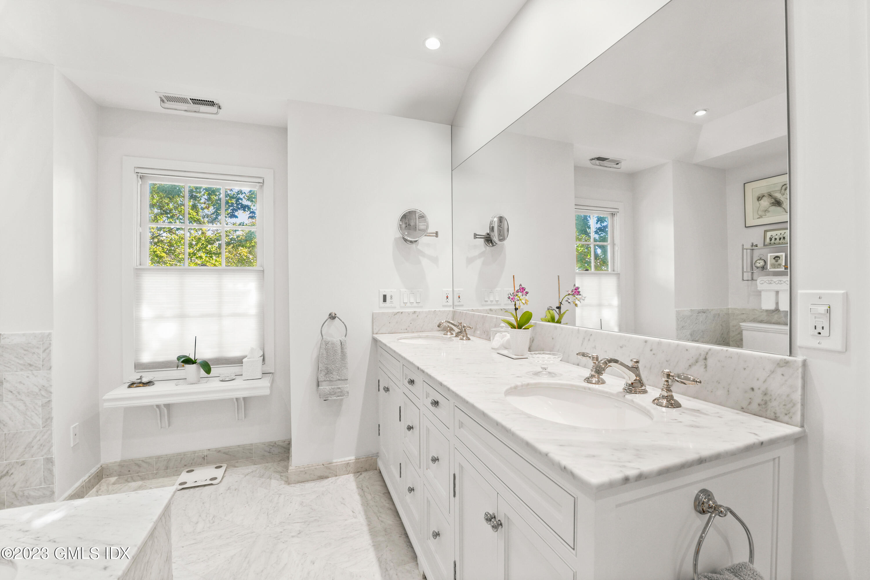 48 Spring Street, Unit 14 Greenwich, CT 06830 - Photo 16 of 29 a bathroom with a sink a toilet and a mirror