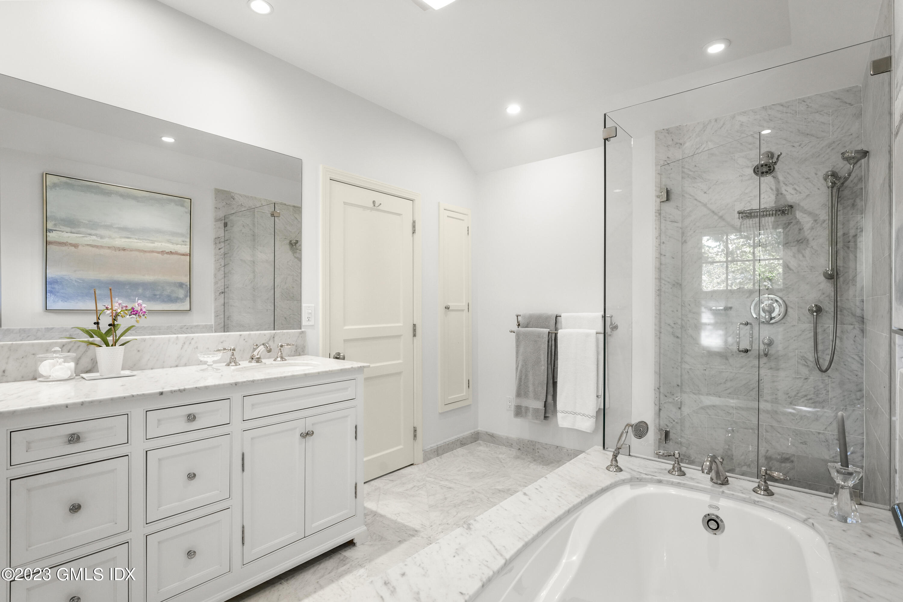 48 Spring Street, Unit 14 Greenwich, CT 06830 - Photo 17 of 29 a bathroom with a double vanity sink mirror double and shower