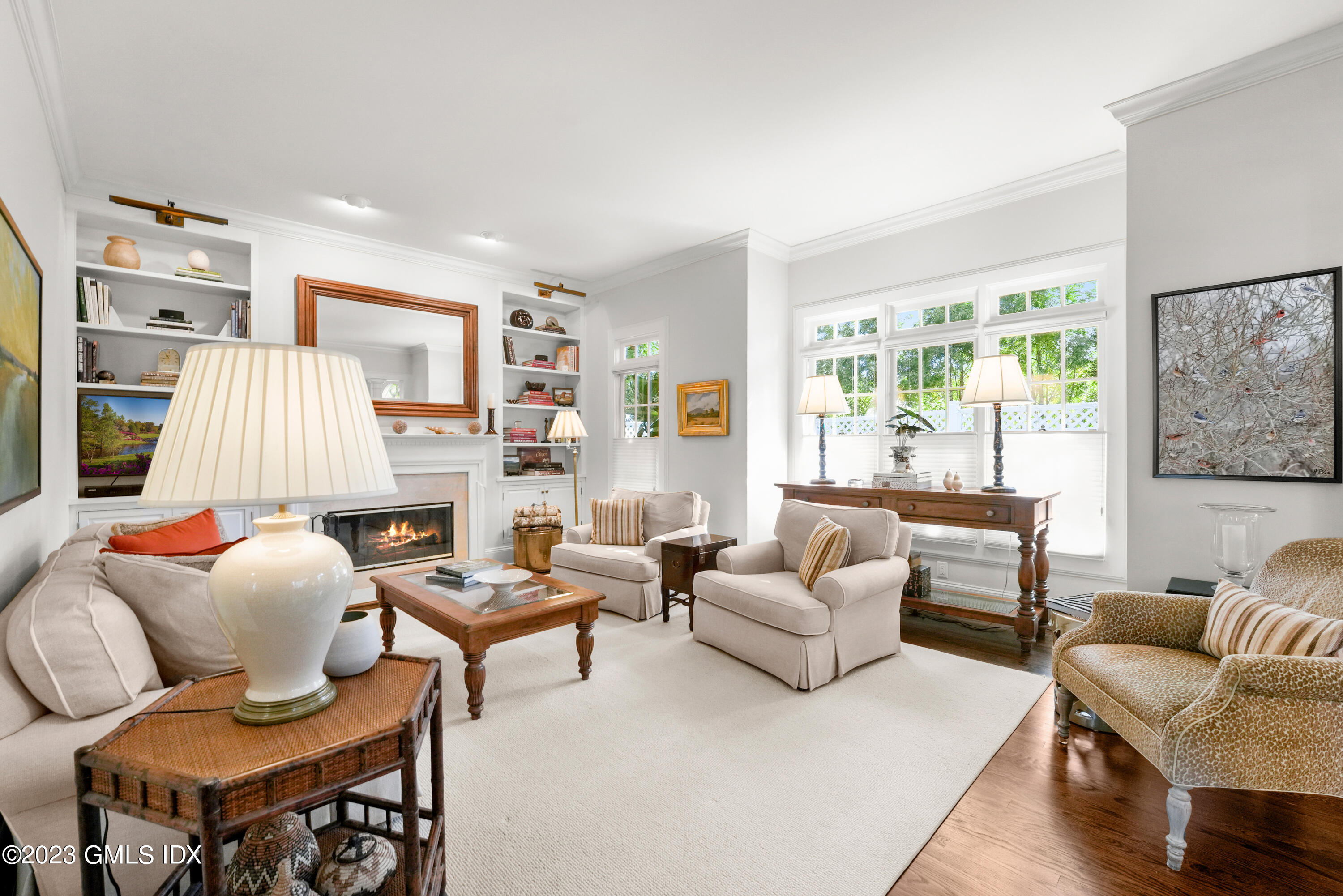 48 Spring Street, Unit 14 Greenwich, CT 06830 - Photo 2 of 29 a living room with furniture or couch and a fireplace
