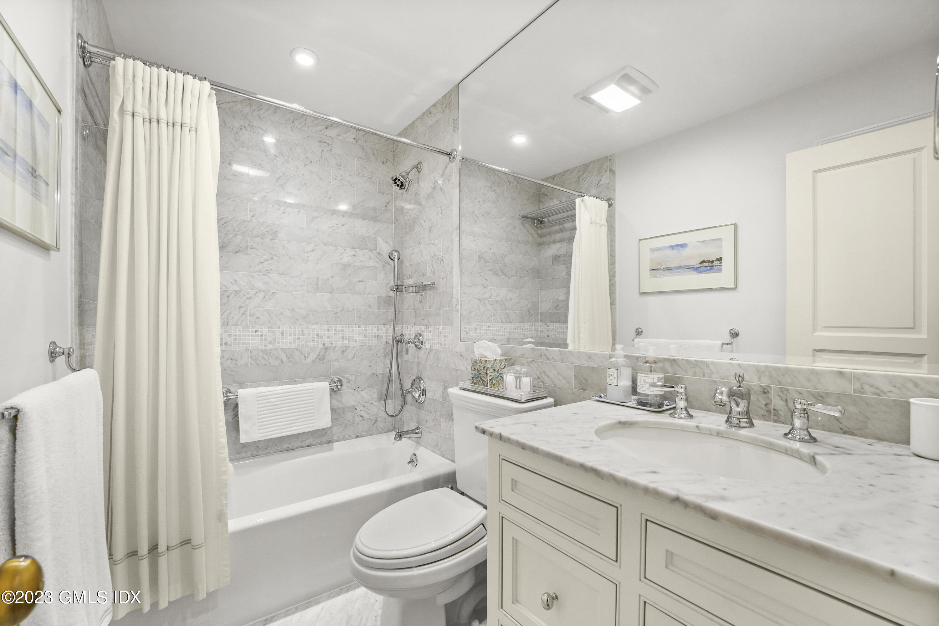 48 Spring Street, Unit 14 Greenwich, CT 06830 - Photo 21 of 29 a bathroom with a granite countertop sink a toilet and shower