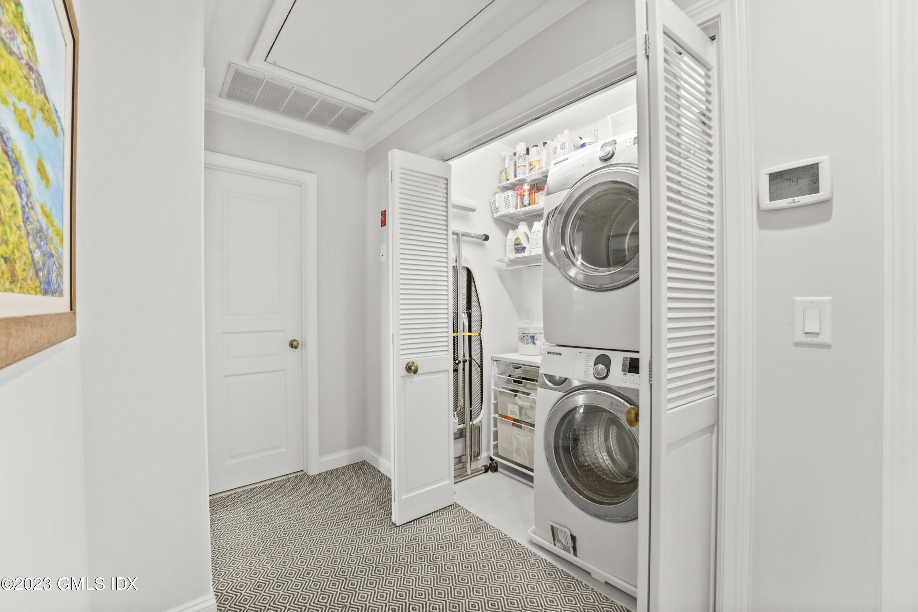 48 Spring Street, Unit 14 Greenwich, CT 06830 - Photo 22 of 29 a utility room with dryer and washer