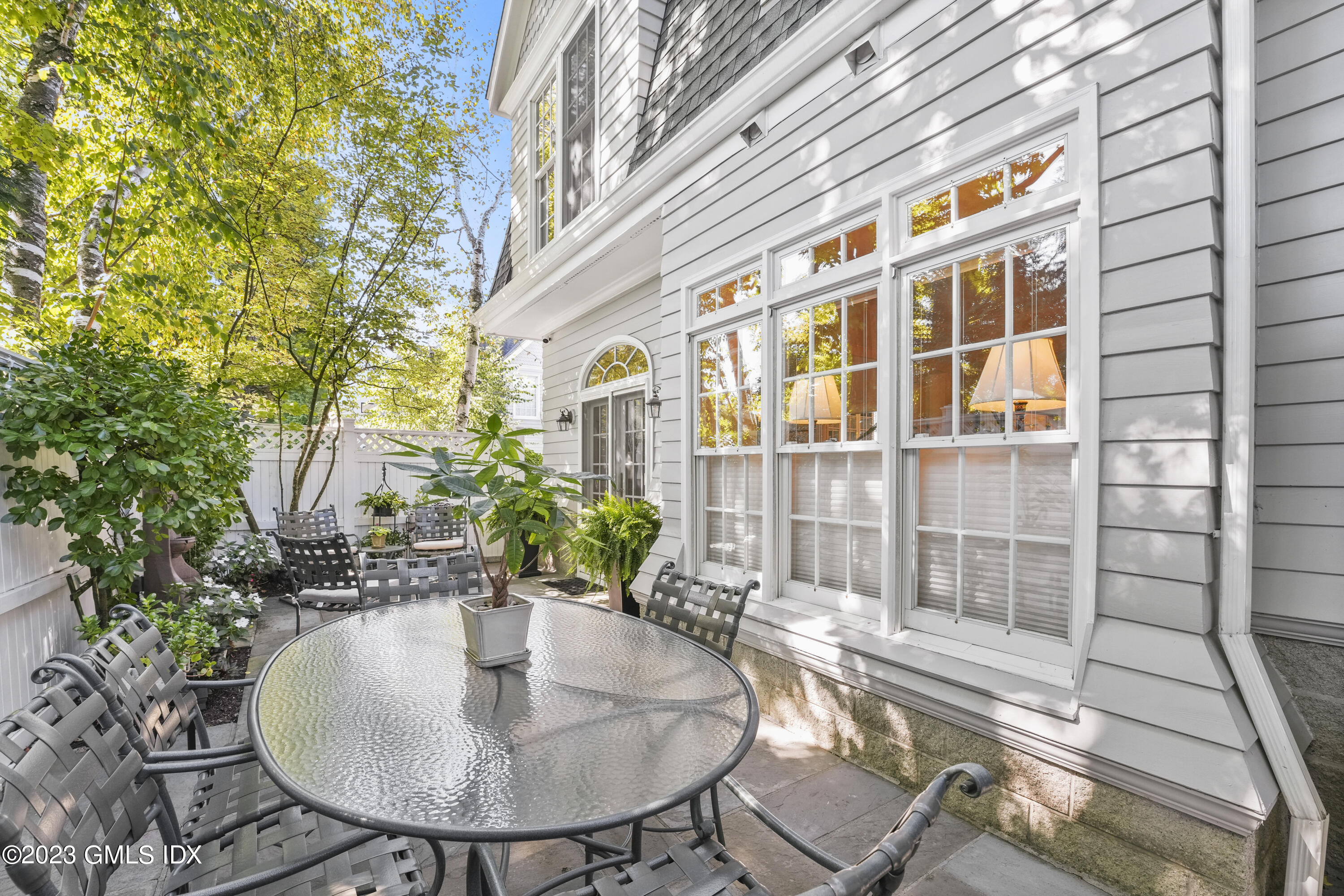 48 Spring Street, Unit 14 Greenwich, CT 06830 - Photo 6 of 29 a view of a balcony with dining table and chairs