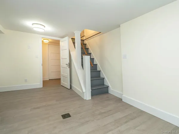 a view of a hallway with staircase