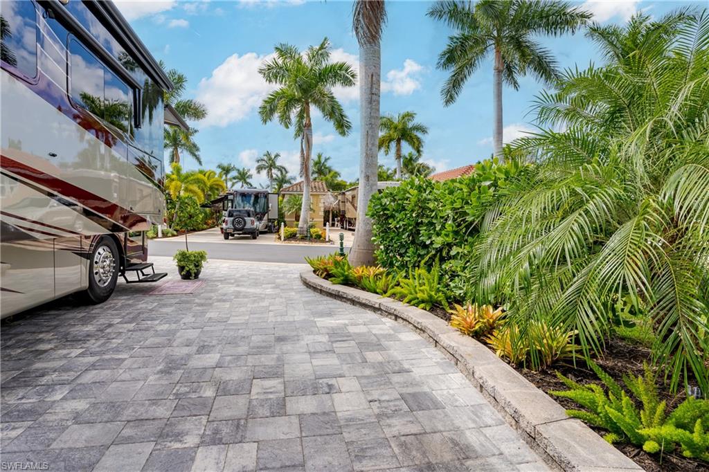 13595 Snook Circle Naples, FL 34114 - Photo 22 of 35 a view of a car park in front of a building