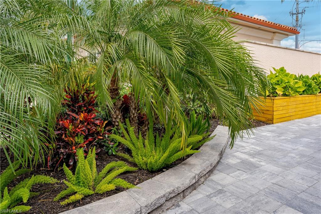 13595 Snook Circle Naples, FL 34114 - Photo 23 of 35 a view of a garden