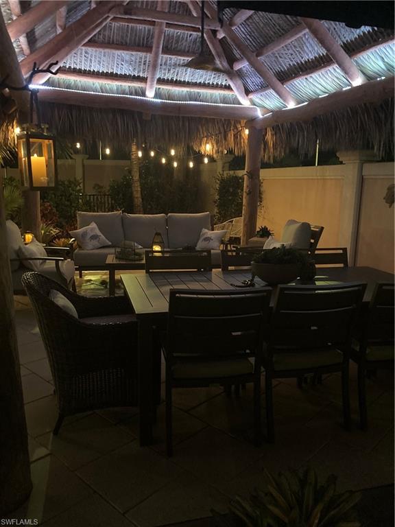 13595 Snook Circle Naples, FL 34114 - Photo 27 of 35 a living room with furniture and a table