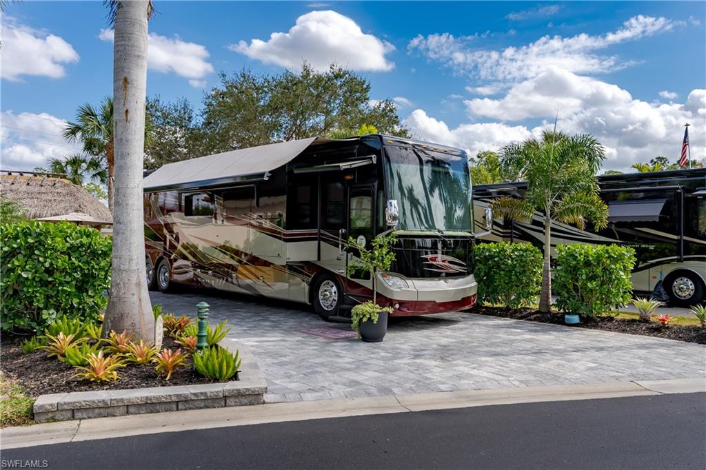 13595 Snook Circle Naples, FL 34114 - Photo 3 of 35 a front view of a house with garden