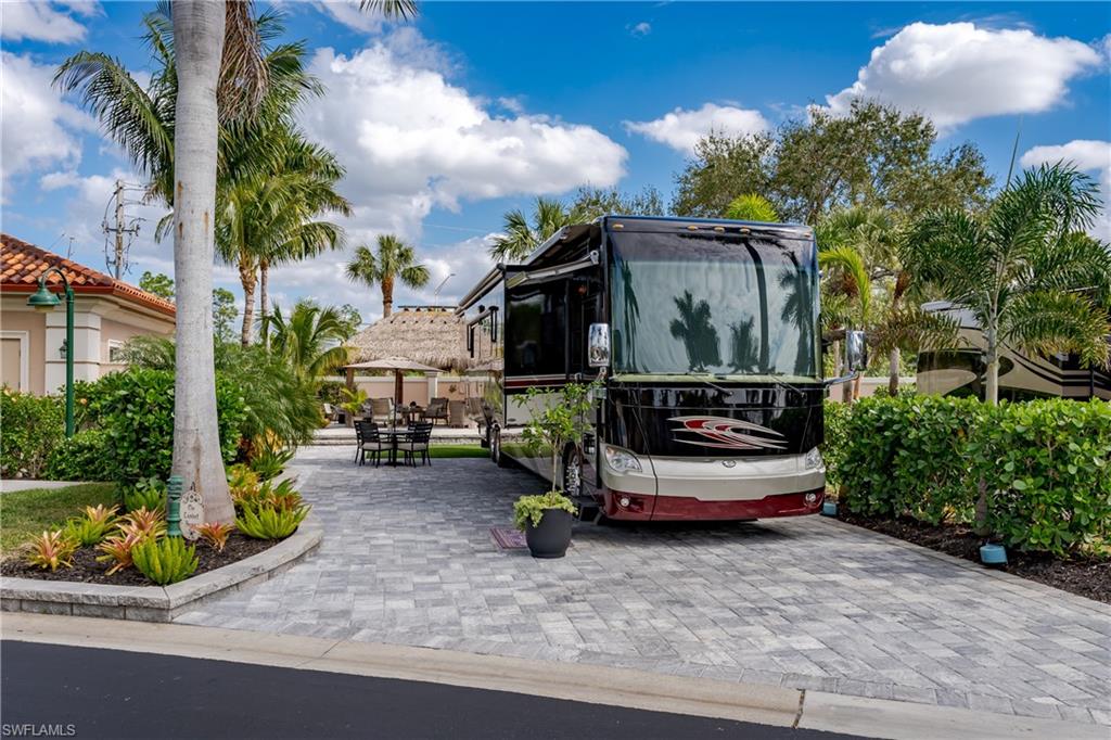 13595 Snook Circle Naples, FL 34114 - Photo 4 of 35 a small garden covered with tall trees