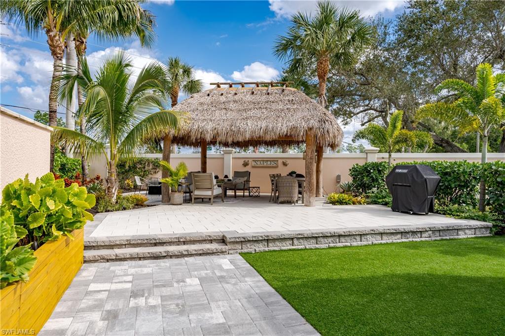 13595 Snook Circle Naples, FL 34114 - Photo 7 of 35 a view of a house with a yard and sitting area