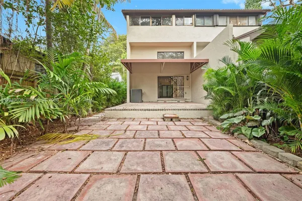 a view of a pathway with a yard