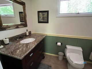 72 Pinnacle Road Ellington, CT 06029 - Photo 29 of 38 a bathroom with a granite countertop toilet sink and mirror