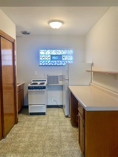 2126 South 18th Avenue Broadview, IL 60155 - Photo 6 of 16 a kitchen with stainless steel appliances a stove refrigerator and cabinets