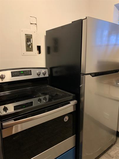 2126 South 18th Avenue Broadview, IL 60155 - Photo 10 of 16 a close up of a microwave and a refrigerator