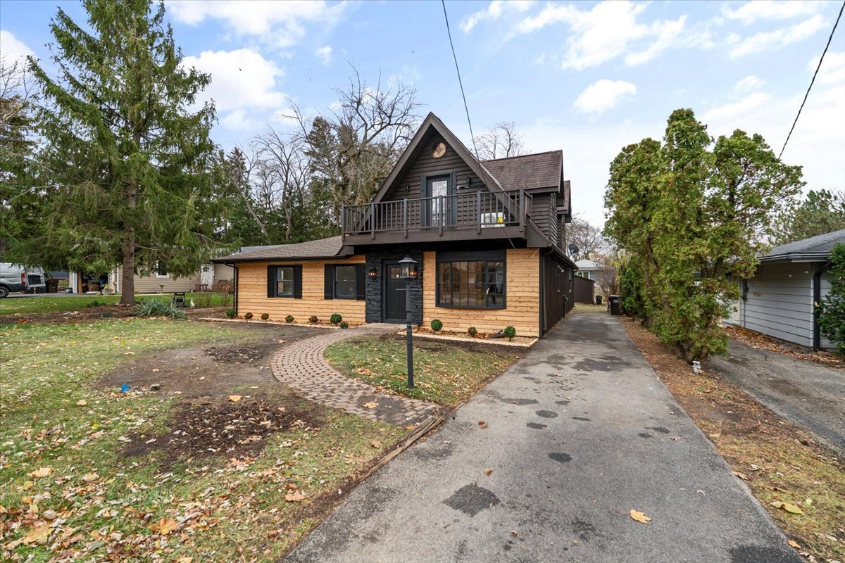 a front view of a house with garden