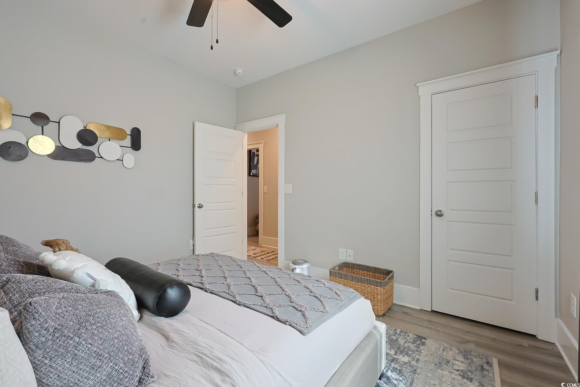 669 Pacific Commons Drive Surfside Beach, SC 29575 - Photo 18 of 36 Bedroom with wood finished floors and a ceiling fan