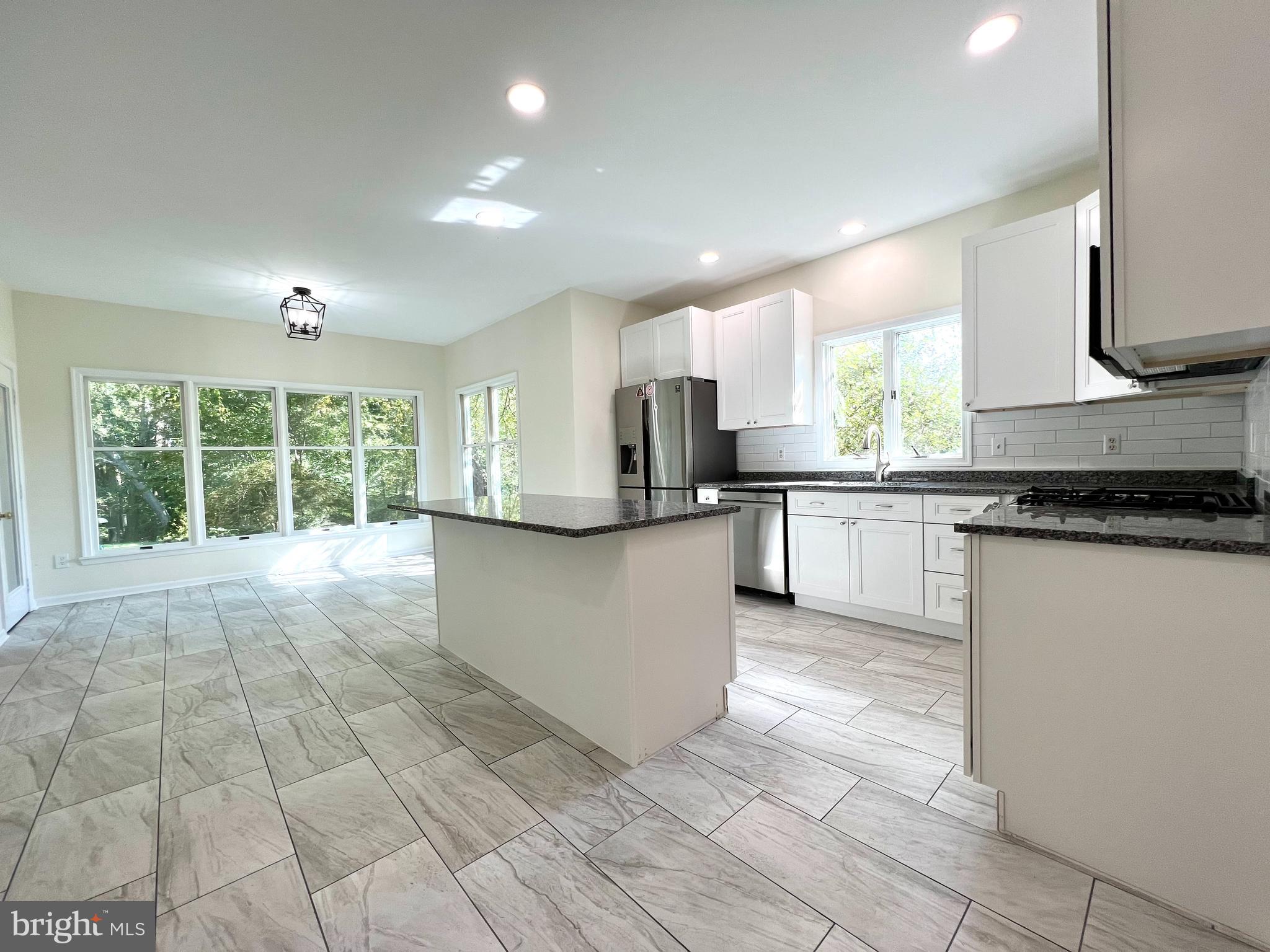 1 Cutter Way Middletown, DE 19709 - Photo 18 of 41 a large kitchen with stainless steel appliances granite countertop a stove a sink and a refrigerator
